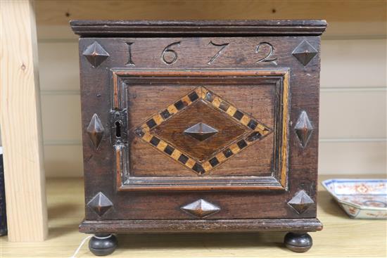 A small oak cabinet, possibly Welsh, c.1672? height 27.5cm